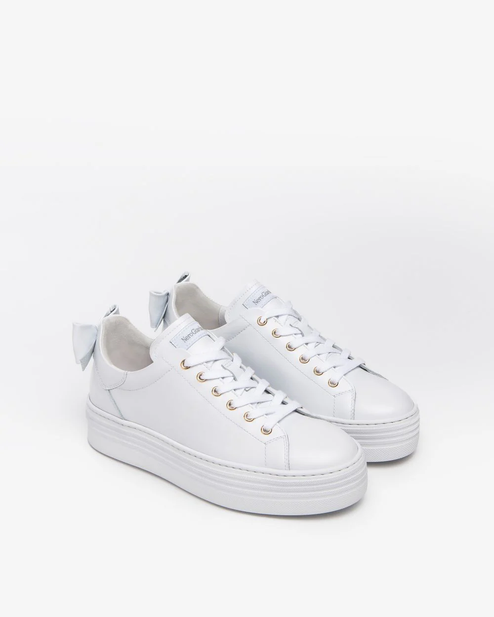 NeroGiardini Bow Flatform Trainer in White NeroGiardini Bow Flatform Trainer in White